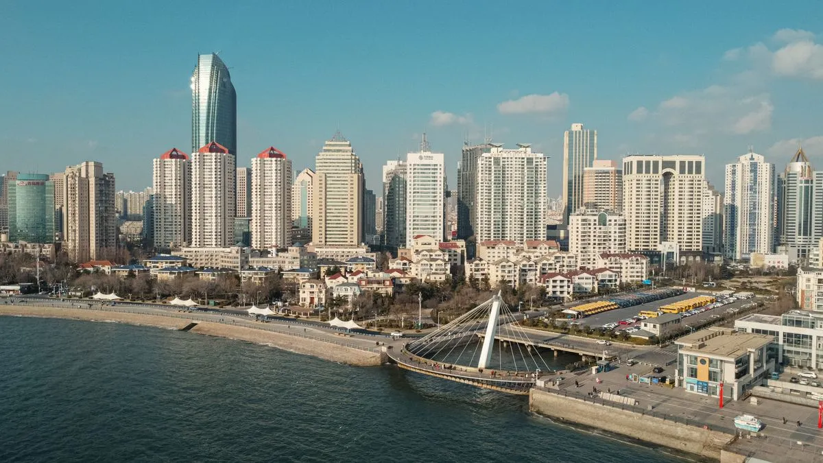 Qingdao city skyline and port area aerial view along the Yellow Sea coast