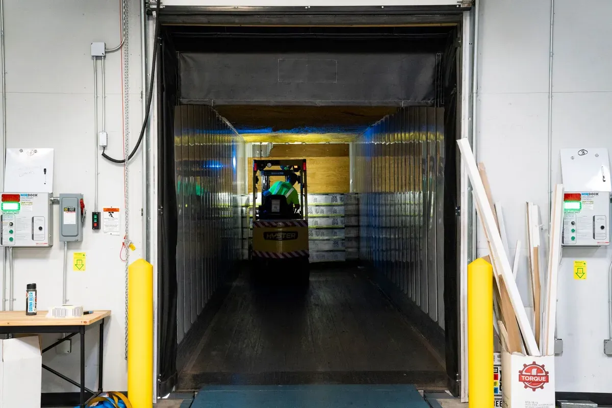 Forklift unloading imported goods in a warehouse near Amman, Jordan