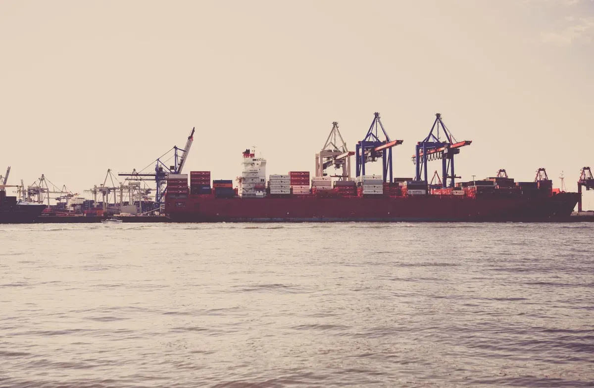 Container ship docked at an industrial port